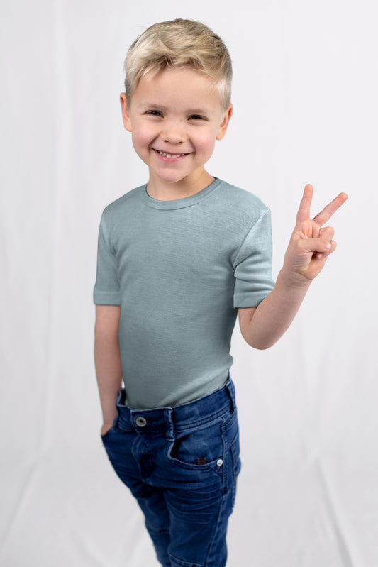 Child wearing Engel organic wool silk shirt as breathable base layer