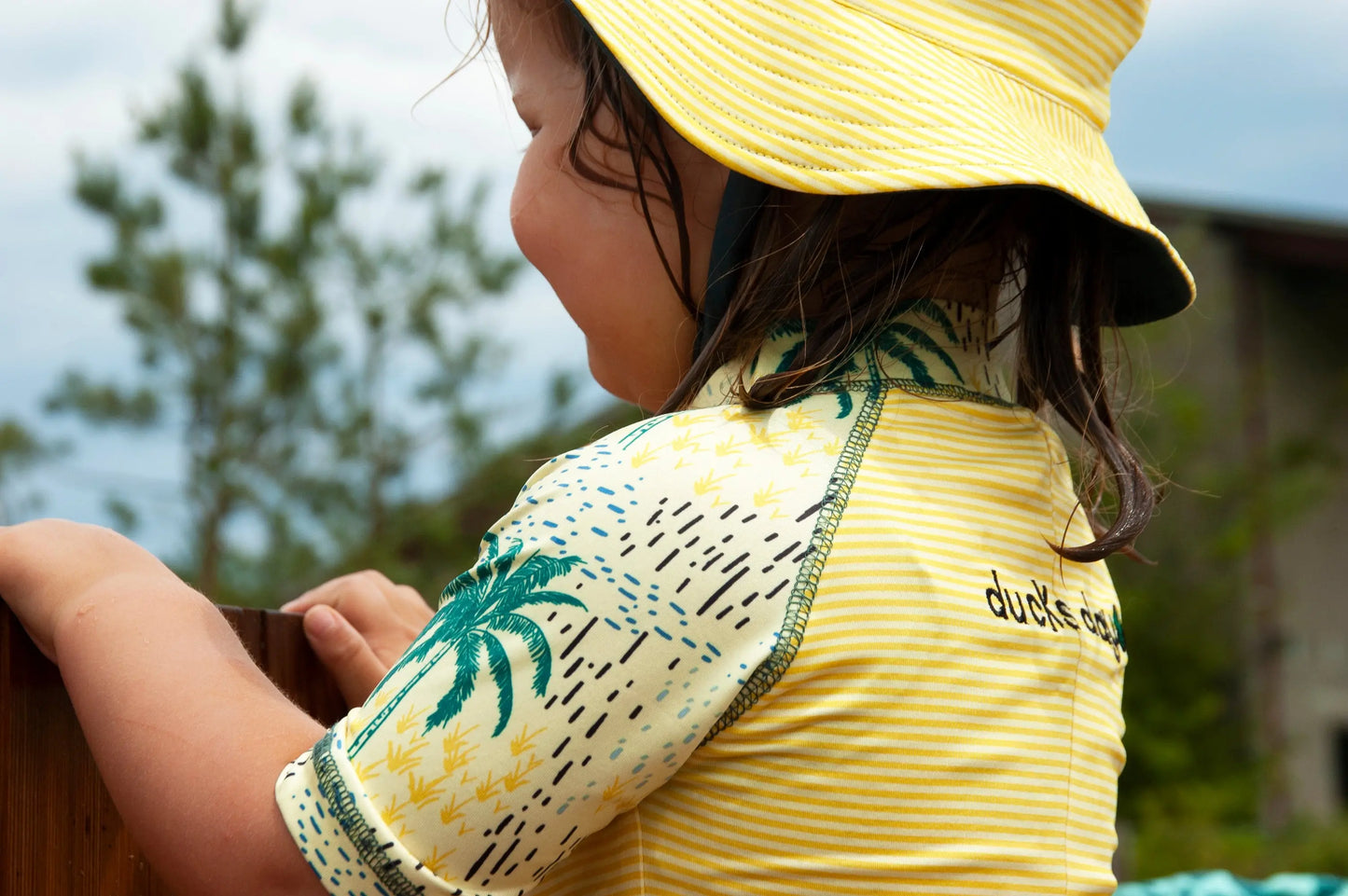front zipper detail on full-body toddler rash guard swimwear