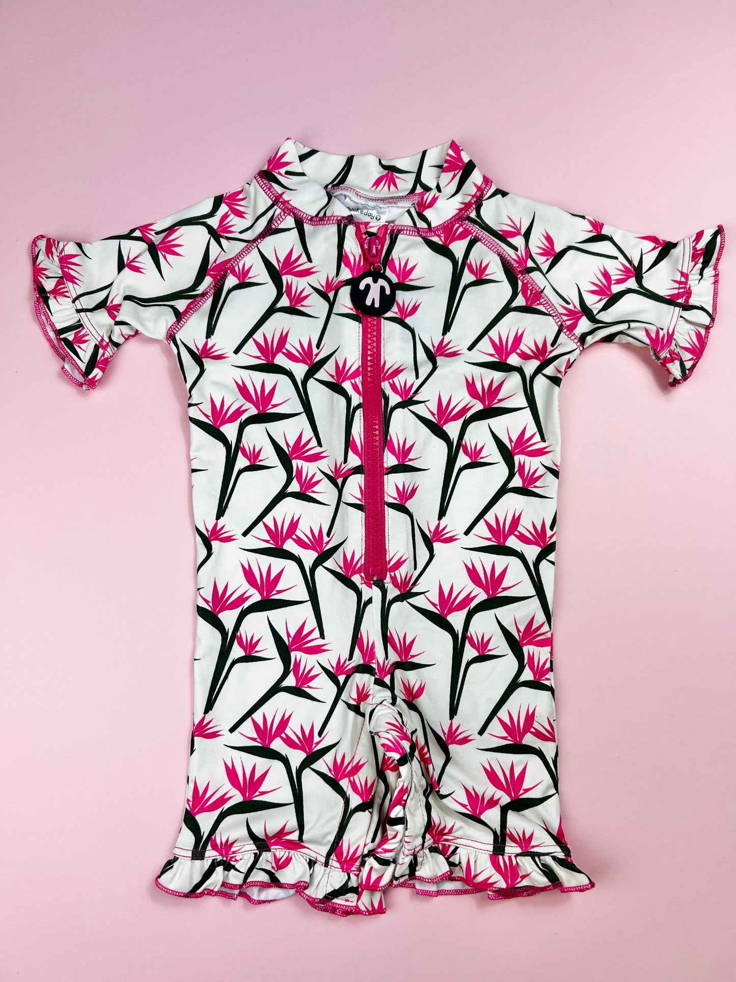 front zipper detail on full-body toddler rash guard swimwear