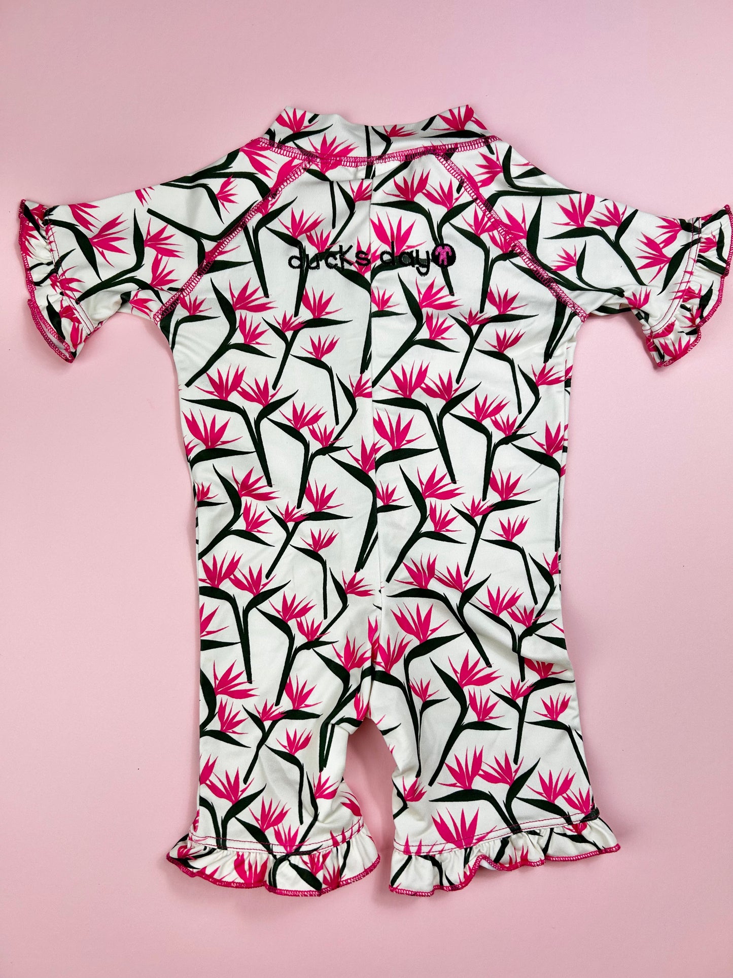 front zipper detail on full-body toddler rash guard swimwear