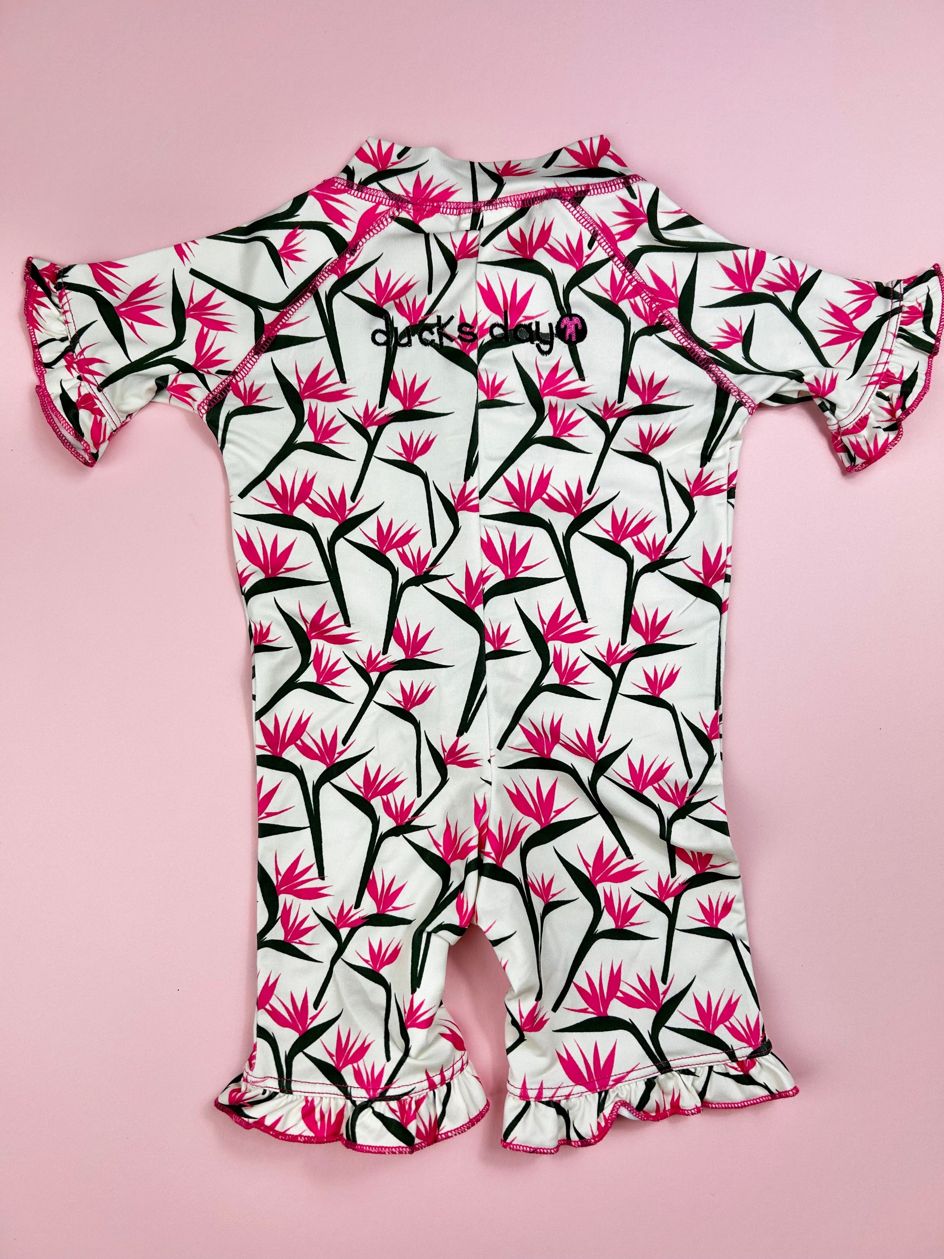 front zipper detail on full-body toddler rash guard swimwear