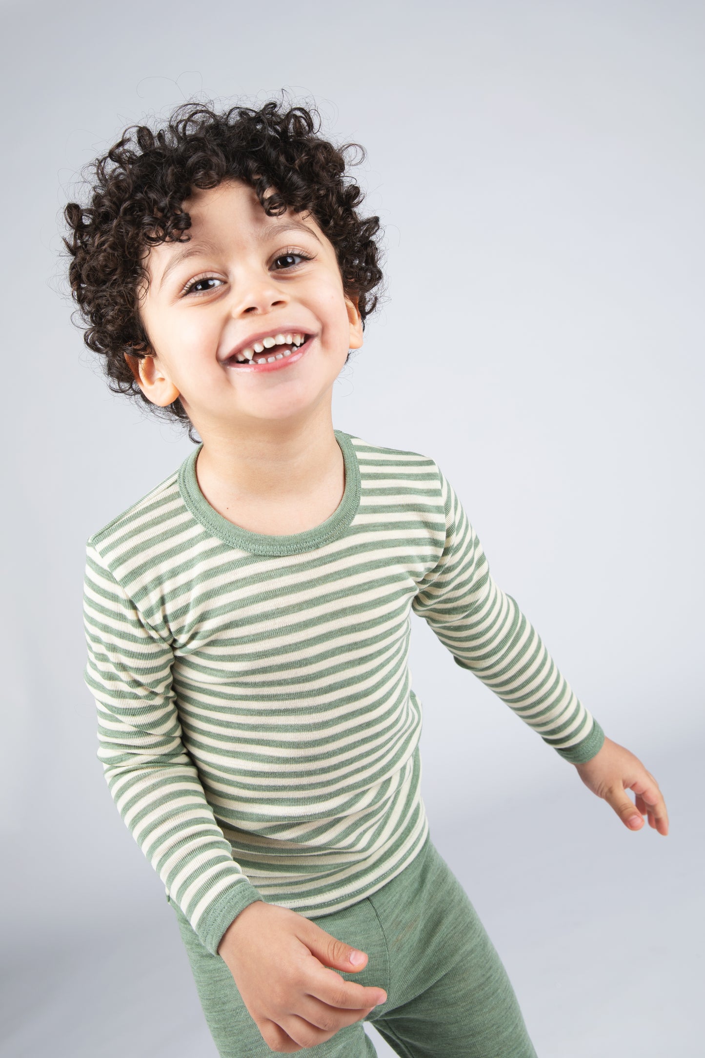 Engel kids organic merino wool long sleeve shirt worn for breathable everyday warmth in sage green