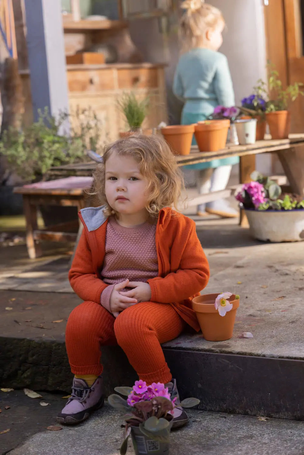 Girl sitting on steps wearing the Baby / Kids Leight Weight Merino Wool Leggings - Lovely Margarethe