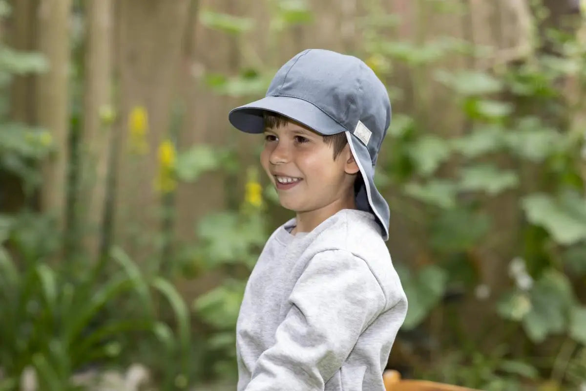 Felix is an Organic Cotton UV Sun Hat made by Pickapooh. It provides full coverage - the front visor shields your little one's face, while their neck stays protected by the back flap. This well made, durable hat will last for many sunny days.